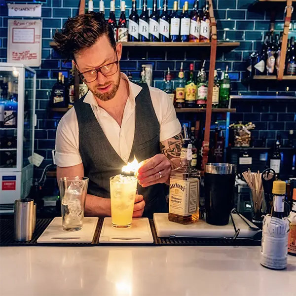 James making cocktails behind the bar